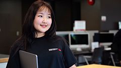 Simon Fraser University student in the library