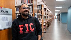 Student in Simon Fraser University library