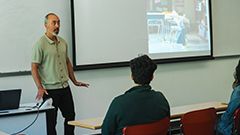 Teacher in front of classroom at Fraser International College